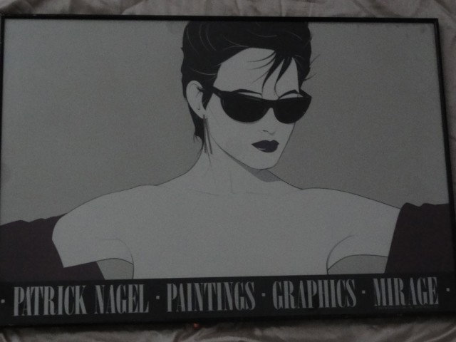 Patrick Nagel Lithograph Exhibition 1983: Patrick Nagel Lithograph from 1983. Mirage Editions INC - Santa Monica, CA Measures: 34x23 Framed. 33x22 Sight.