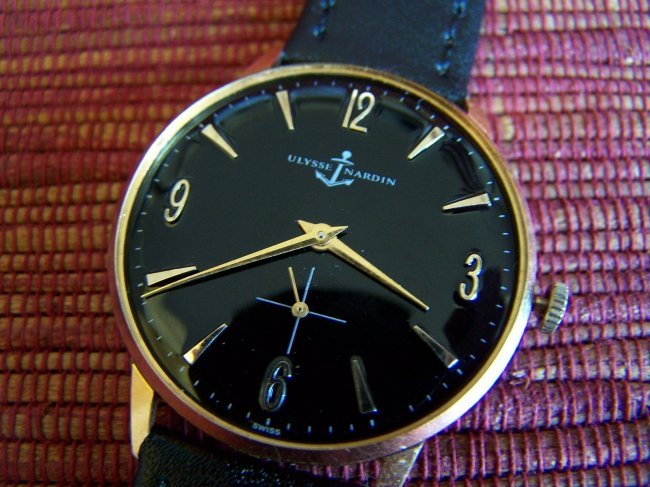 ULYSSE NARDIN METALLIC BLACK DIAL MENS WATCH: 35mm /large case aprox without crown, 18mm between lugs and 41mm from lug to lug, solid metal chromed in very good condition with snap on back cover, Ulysse Nardin hallmark inside, Great black metalli