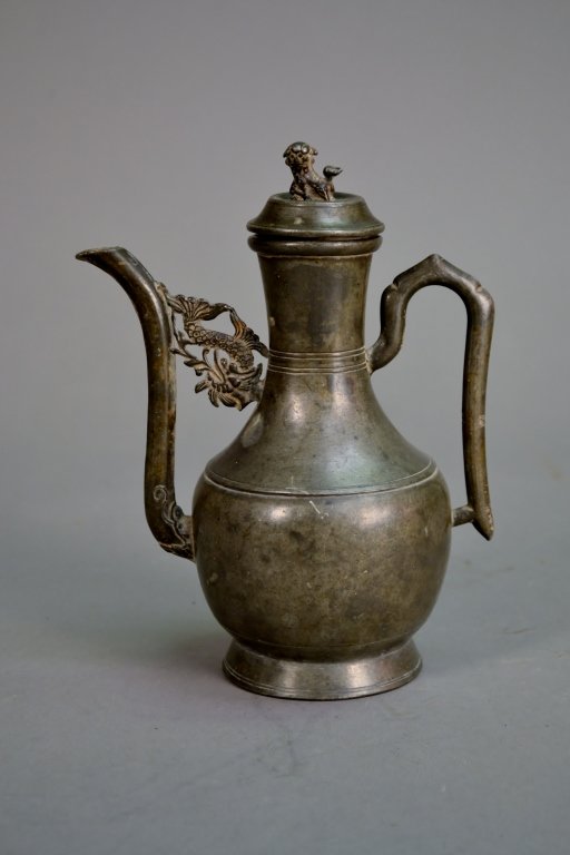 Antique Chinese Pewter Wine Pot: This is a very nice wine pot. There is a foo dog upon the top of the lid and an impressed seal mark to the base. The size is 7" T X 5 1/2 " W.