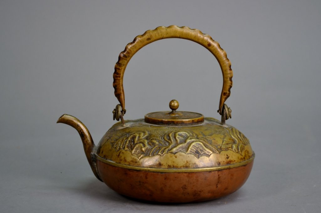 Antique Brass and Copper Tea Pot: This is a very well made tea pot with good artistic designs, nice item. The size is 5 1/2" T X 6 3/4" W.