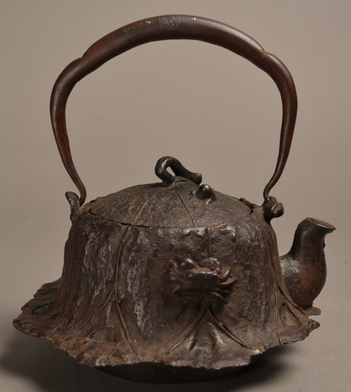 Antique Mixed-Metal Teapot: Iron Teapot with silver inlays to the handle depicting frogs and crabs. 7 3/4" X 7 1/2".