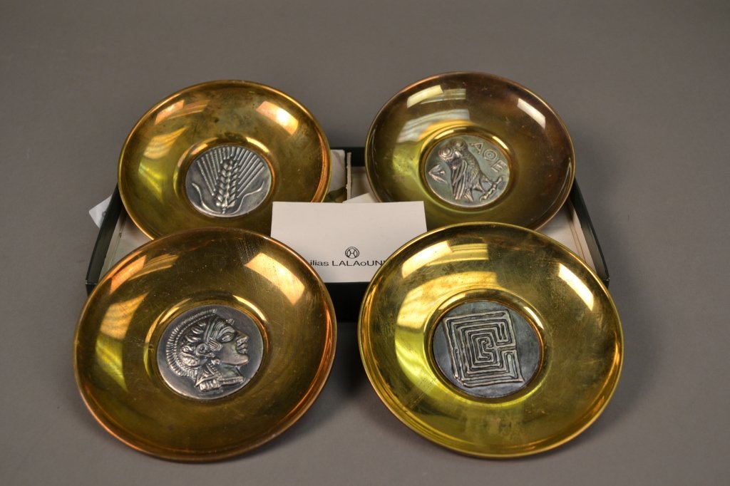 Ilias Lalaounis Brass & Sterling Decorative Plates: 4 decorative plates by Ilias Lalaounis, brass inset with sterling silver medallions depicting classical themes. Each 4 3/4" dia.