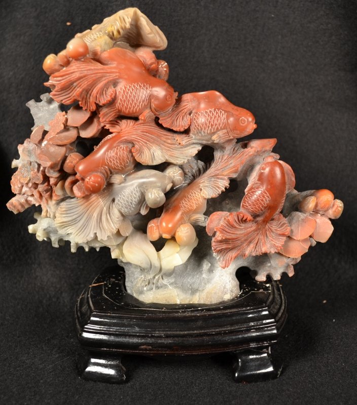 Soapstone Carving of Koi: Carved soapstone sculpture depicting swimming koi, on wooden base. 7" x 6 3/4".