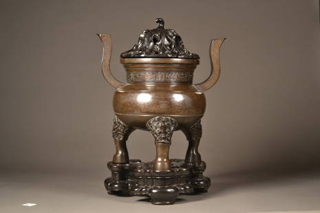 Antique Chinese Bronze and Silver Mixed Metals Koro: Large Bronze & Silver mixed metal Koro, with very intricate designs featuring carved wooden lid, and is on a fantastic carved wooden stand. H: 18.5", W: 13.25"