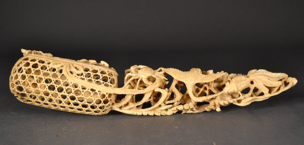 Antique Ivory Carving: Highly detailed antique ivory carving with an oceanic theme, depicting crabs snared within a latticework net, and pelicans and crabs in stunning high relief throughout. An exceptional piece. Measures