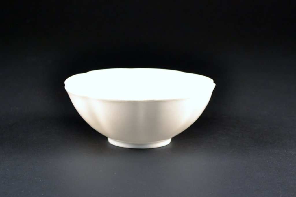 White Glazed Lobed Eggshell Bowl: Lovely white eggshell porcelain lobed bowl in box. Measures 5 1/2" dia x 2 1/4" tall.