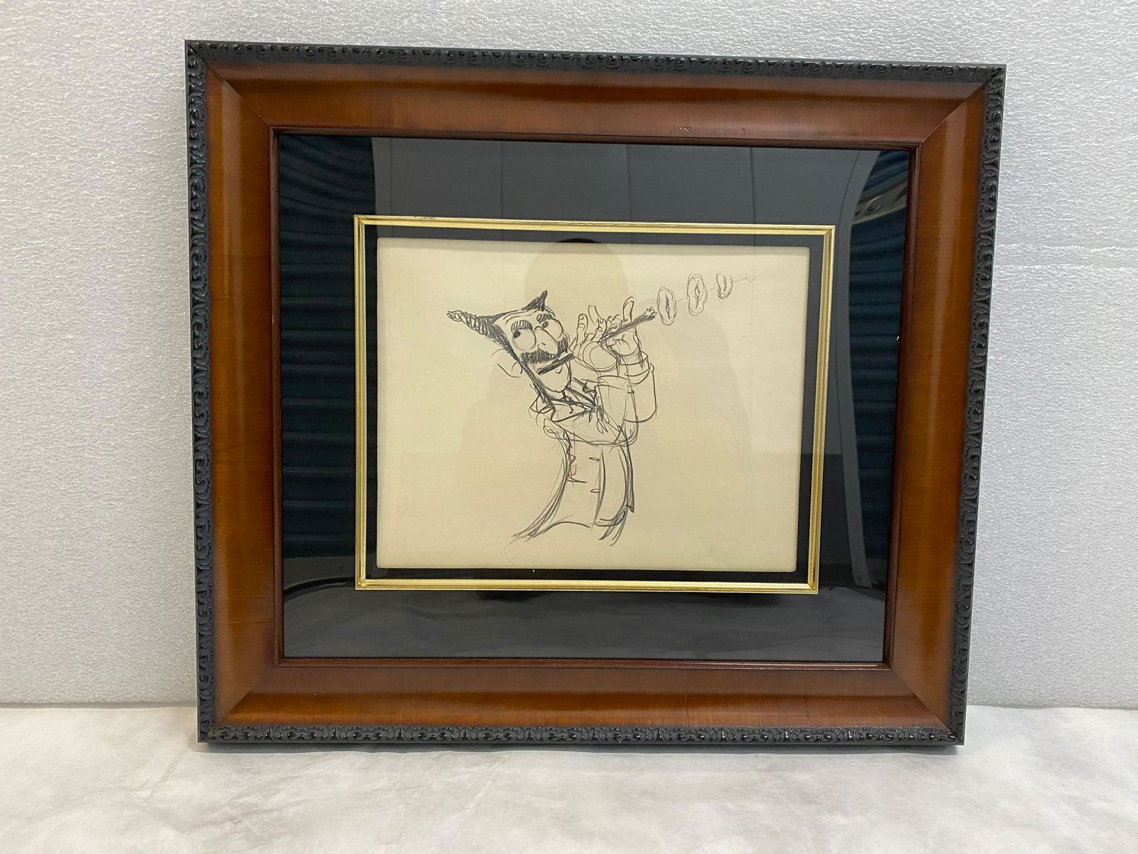 Pen and pencil drawing of Groucho Marx from "Mother: Pen and pencil drawing of Groucho Marx from "Mother Goose Goes Hollywood" 1938 Disney Studios, Statement of Authenticity signed by Sally Walsh H 17" x W 19 1/2" D 1 1/2" Wood frame with black mat