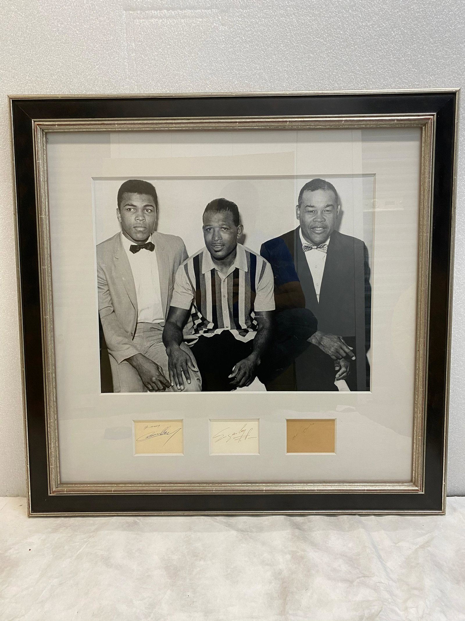 VINTAGE RARE 8x10 B/W Photo of Cassius Marcellus Clay: VINTAGE RARE 8x10 B/W Photo of Cassius Marcellus Clay Jr., better known as "Muhammad Ali" photographed with Sugar Ray and Joe Lewis. Autographed by all three reads; "From Cassius Clay, Sugar Ray, Joe 