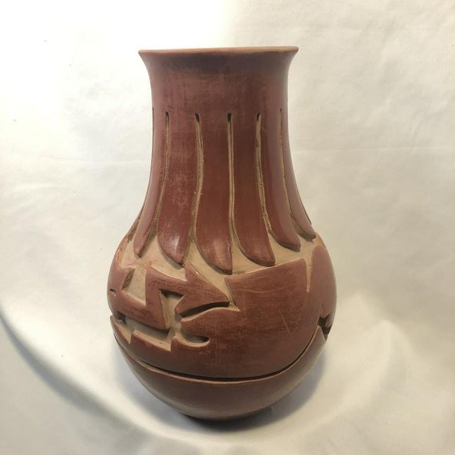 Nida Tafoya Carved Red Clay Vase: Nida Tafoya Carved Red Clay Vase from Santa Clara Puebro, New Mexico. Height: 9" Circumference: 18.5" Diameter 3.5"; Signed Nida Tafoya. Margaret "Nida" Tafoya began showing and selling her work when 