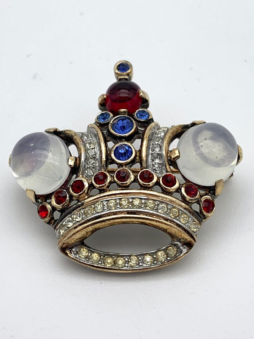 Sterling Trifari Alfred Philippe Vermeil Crown Brooch: Circa 1940s "King's Crown" brooch by designer Alfred Philippe. A vermeil finish, It is marked "Trifari, Des. Pat. No. 137542". It measures approximately 2" wide. Marked “sterling”. 12.2 grams