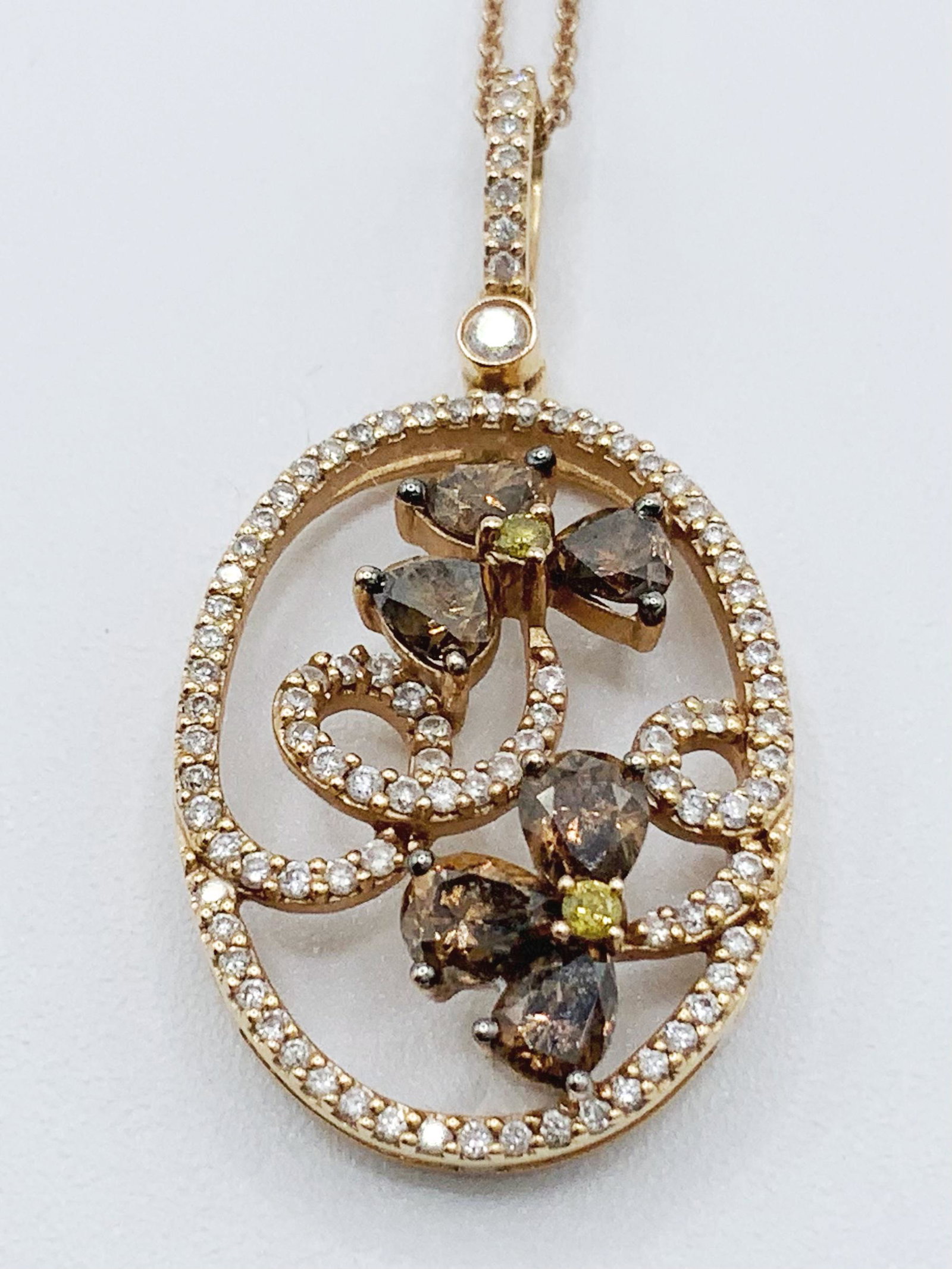 18kt Gold Citrine/Peridot/Diamond Necklace: 18kt YG pendant with Citrine, Peridot, and Diamond gemstones. 14 kt chain 6.2 grams total. End to end chain measures 18" THIS LOT IS LOCATED AND SHIPPING FROM CORONA DEL MAR, CA.