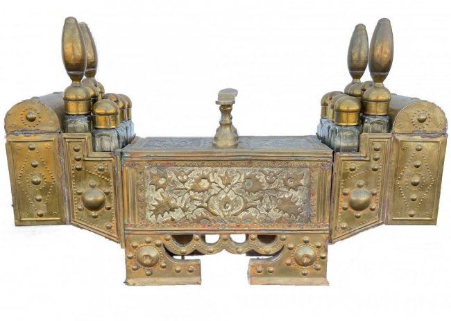 Antique Middle Eastern Shoe Shine Stand: Antique Middle Eastern Shoe Shine Rack - Made from Brass with hand hammered ornamentation and 16 original glass bottles and lids. Great Patina on the piece ~ 32in w x 7.5in d x 20.5in t