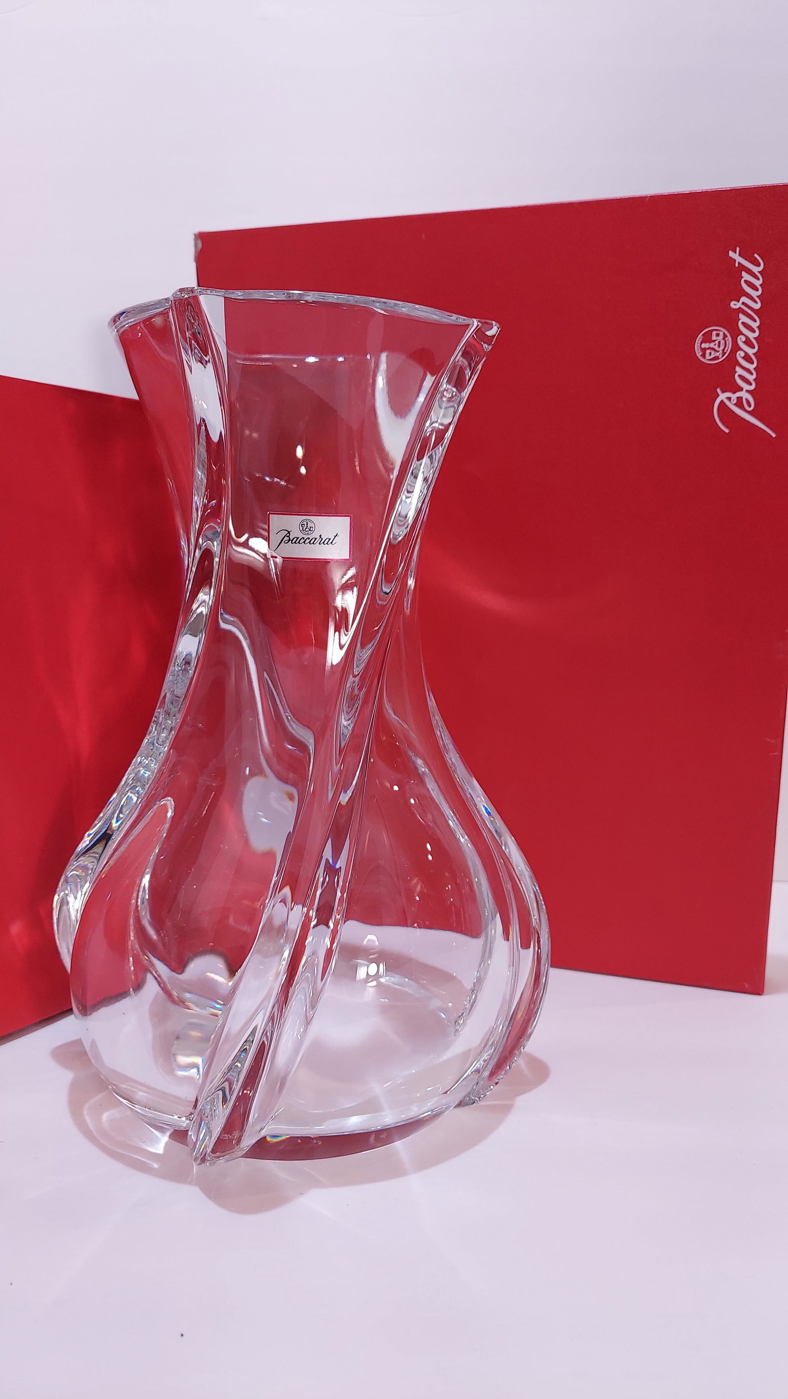 Baccarat - Crystal 10" Vase "Serpentin" Clear: Baccarat - Crystal Vase "Serpentin" ClearThe deft gracefulness of the vase highlights Baccaratâ€™s signature artistry and expertise, and the elegant pleating in the silhouette wrings a gentle who