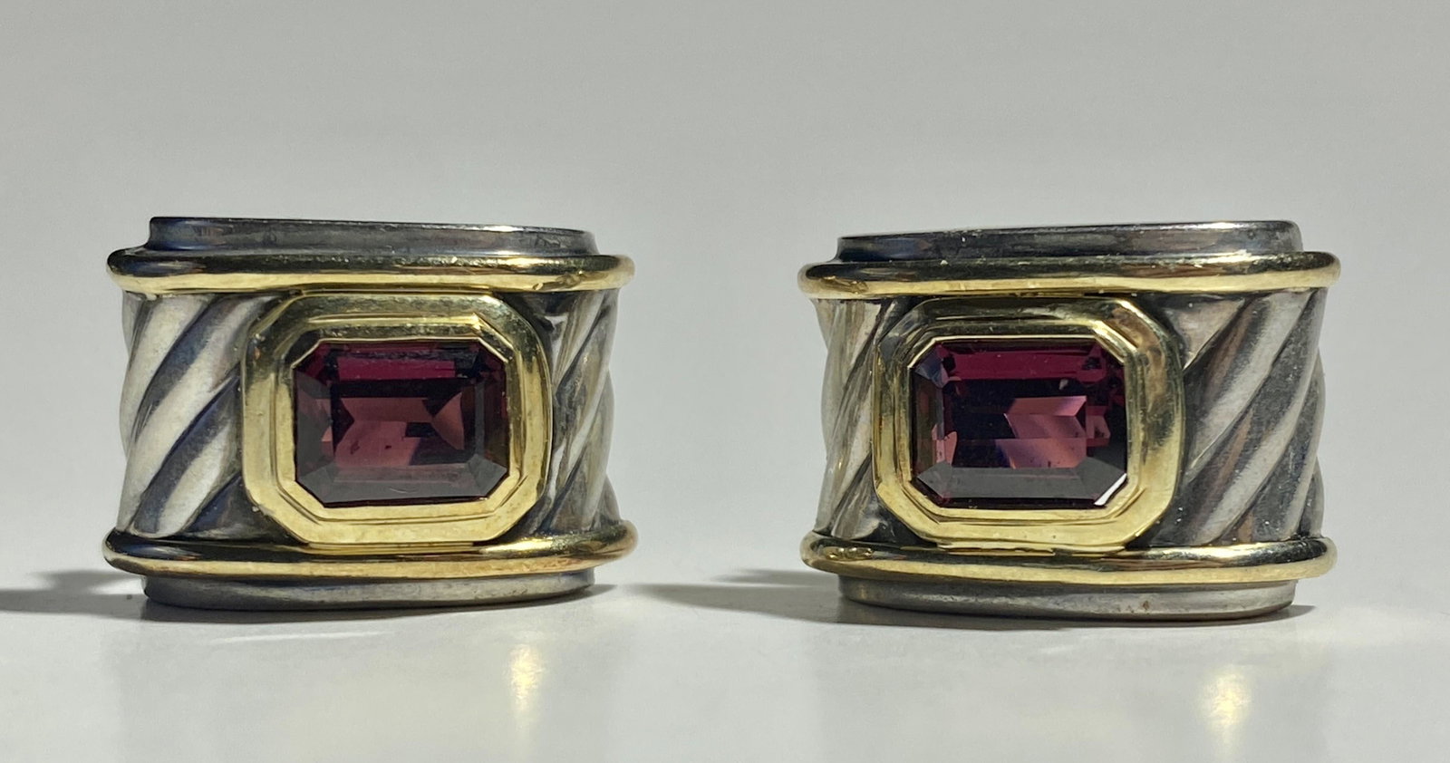 David Yurman Garnet stone Sterling silver and 14k gold: Sterling silver and 14k gold cable desgin earrings with Emerald cut garnet.