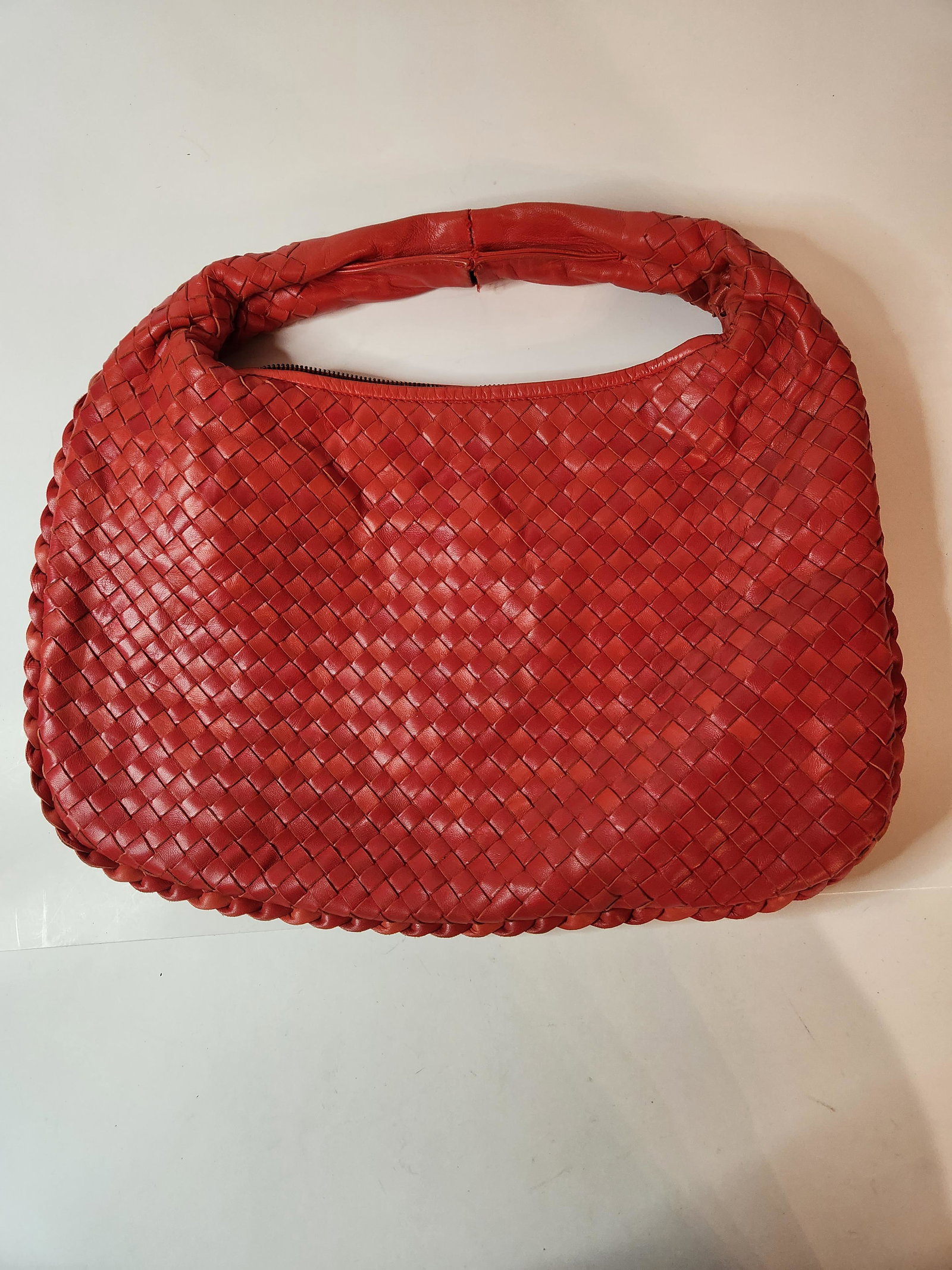 Bottega Veneta Red Woven Leather Purse with Satin Interior: Bottega Veneta Red Woven Leather Purse with Satin inside. Made in Italy. Wear and tear on strap. From the Estate of Sonia Rivelli Jiavis, Las Vegas, NV.