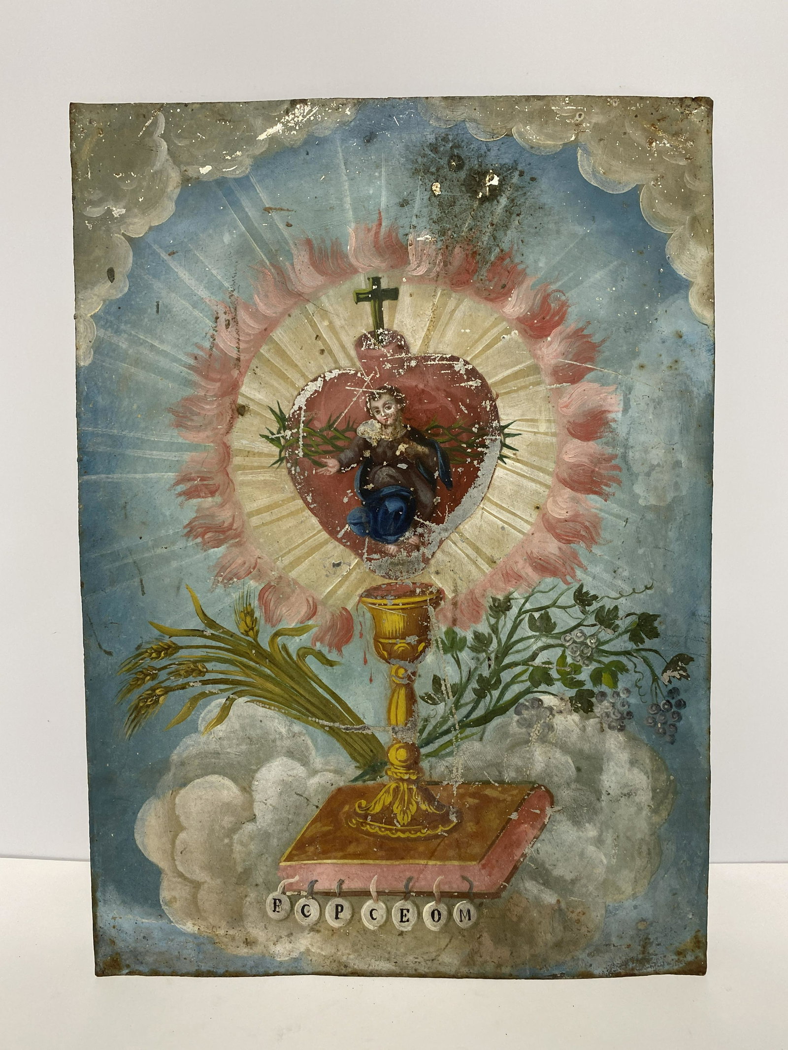 Spanish Colonial "Eucharist of Christ" Retablo Oil on Tin: Spanish Colonial "Word of Gospel" Retablo Oil on Tin - This artwork depicts Christ's Sacred Heart within a piece of Eucharist over a chalice dripping with the blood, representing His body and blood. I
