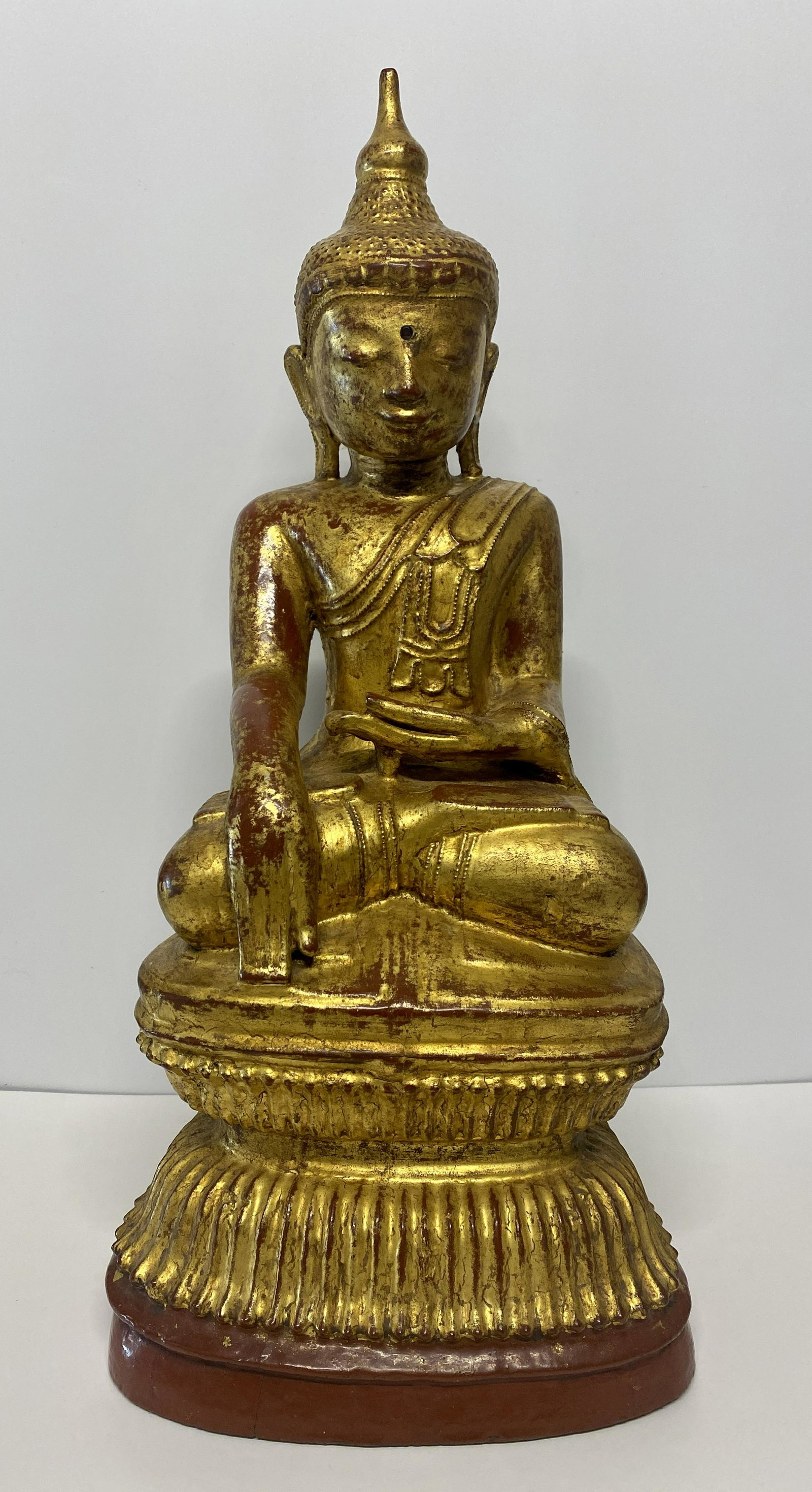 Gilt Wooden Shan Buddha: Gilt Wooden Shan Buddha - The position of the Buddha is sitting with legs crossed at the ankles, with his right hand on the knee and the left in his lap. This position is better known as Vajrasana and