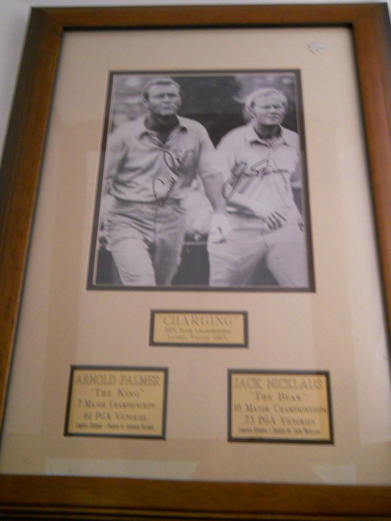 ARNOLD PALMER, JACK NICKLAUS DOUBLE SIGNED PHOTO: Golfing photograph of Arnold Palmer and Jack Nicklaus double signed and framed. APPROX 21"H X 16"W