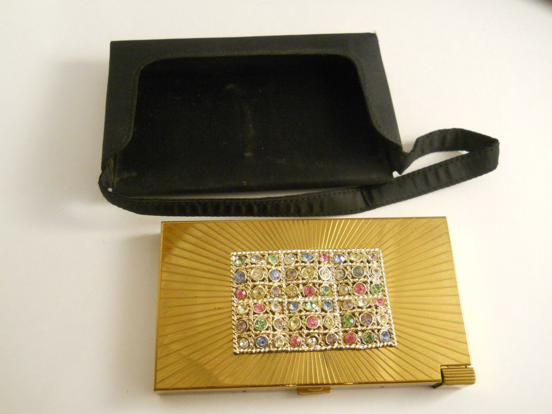VINTAGE VOLUPTE COSMETIC COMPACT: Vintage Volupte cosmetic case embellished with multi-color rhinestones. Fitted with handled black case. Approx. 6"wide x 4"High