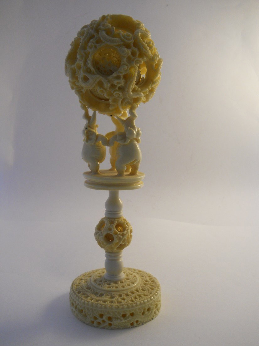 CHINESE PUZZLE BALL, 3 ELEPHANT STAND, 2PC: Beautifully crafted Chinese puzzle ball with pedestal stand topped with 3 elephants to hold the Puzzle ball. Approx. 10.5" H with ball, 7.5" stand only, 3.5"diameter of ball