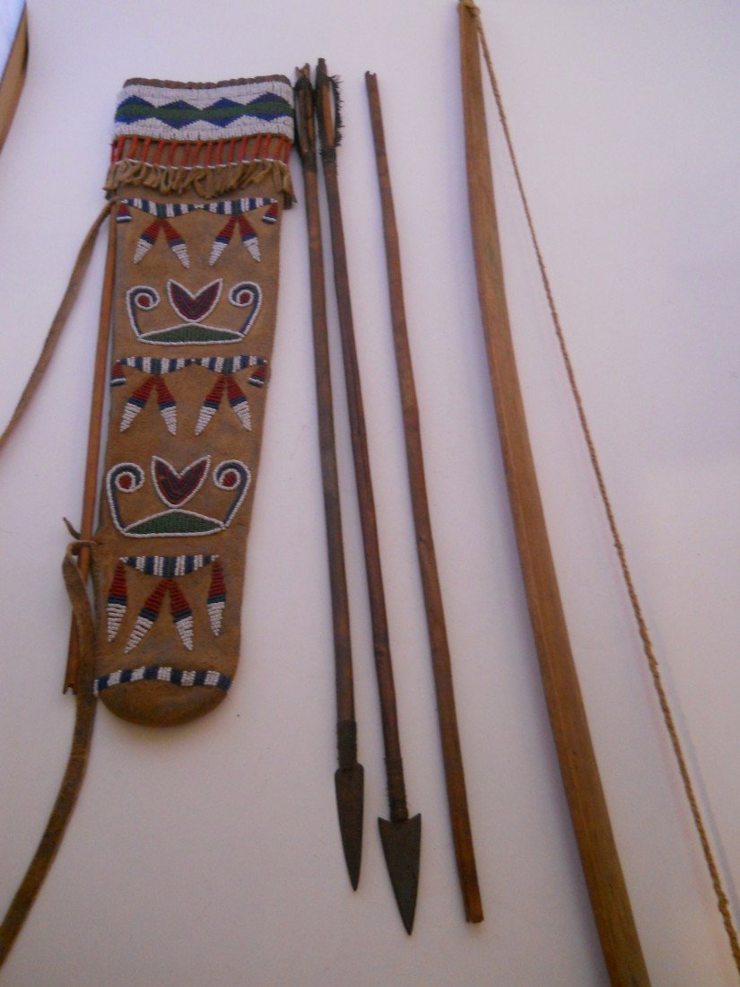 C 1880 QUIVER BOW AND ARROWS, SEED BEADED POUCH: QUIVER BOW AND ARROWS WITH SEED BEADED POUCH VERY OLD! QUIVER BOW APPROX. 31"LONG ARROW POUCH APPROX. 19"LONG X 5"WIDE AT TOP X 3"WIDE AT BOTTOM ARROWS APPROX. 23"LONG