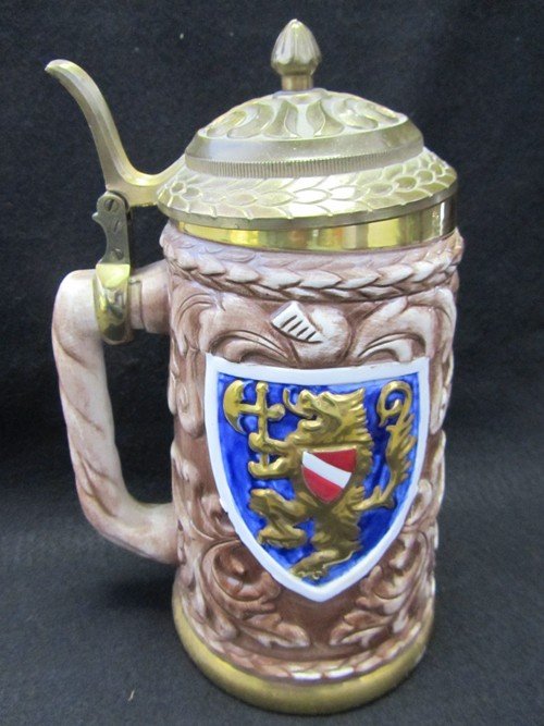 PEWTER LIDDED JAPANESE BEER STEIN, GRIFFON: LARGE PEWTER LIDDED JAPANESE PORCELAIN BEER STEIN, WITH GRIFFON DESGIN ON EACH SIDE. THIS STEIN WAS CRAFTED IN NAGOYA, JAPAN BY SEYEI FINE CHINA. YOU WILL FEEL LIKE ROYALITY DRINKING FROM THIS STEIN. 