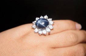 14KT WHITE GOLD STAR SAPPHIRE AND DIAMOND RING: Blue Star Sapphire-Greenish Blue Color 13.85CT Sapphire 12 Round Diamonds 2.52CTW,14k WHITE GOLD