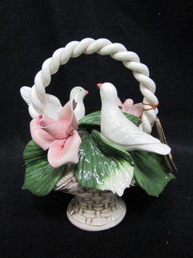 ITALIAN PORCELAIN CAPODIMONTE DOVES IN BASKET: ITALIAN PORCELAIN CAPODIMONTE, DOVES IN BASKET WITH ORIGINAL INFORMATION BOOKLET. APPROX 3'' TALL X 2'' WIDE