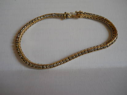 14K GOLD TENNIS BRACELET 11.4 GRAMS: GOLD BRACELET 14K CAST SETTING WITH A HIGH POLISH FINISH,STAMPED 14K,WEIGHING 11.4 GRAMS, MEASURES 6 3/4 INCHES LENGTH AND 3 MM IN WIDTH,75 ROUND BRILLIANT CUT DIAMONDS,SI CLARITY,G-H COLOR,APPROX