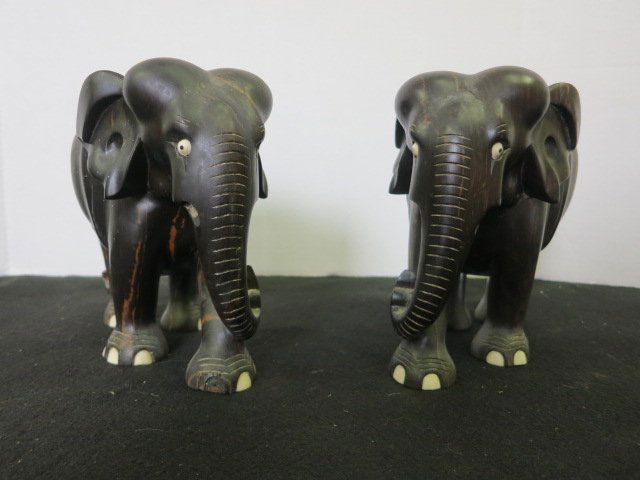 HAND CARVED WOOD ELEPHANT FROM MACASSAR WOOD 2 PC: An extremely beautifully carved elephant made from macassar wood. It has a dark chocolate colour with some lighter streaking throughout. APPROX. 7'' X 6''