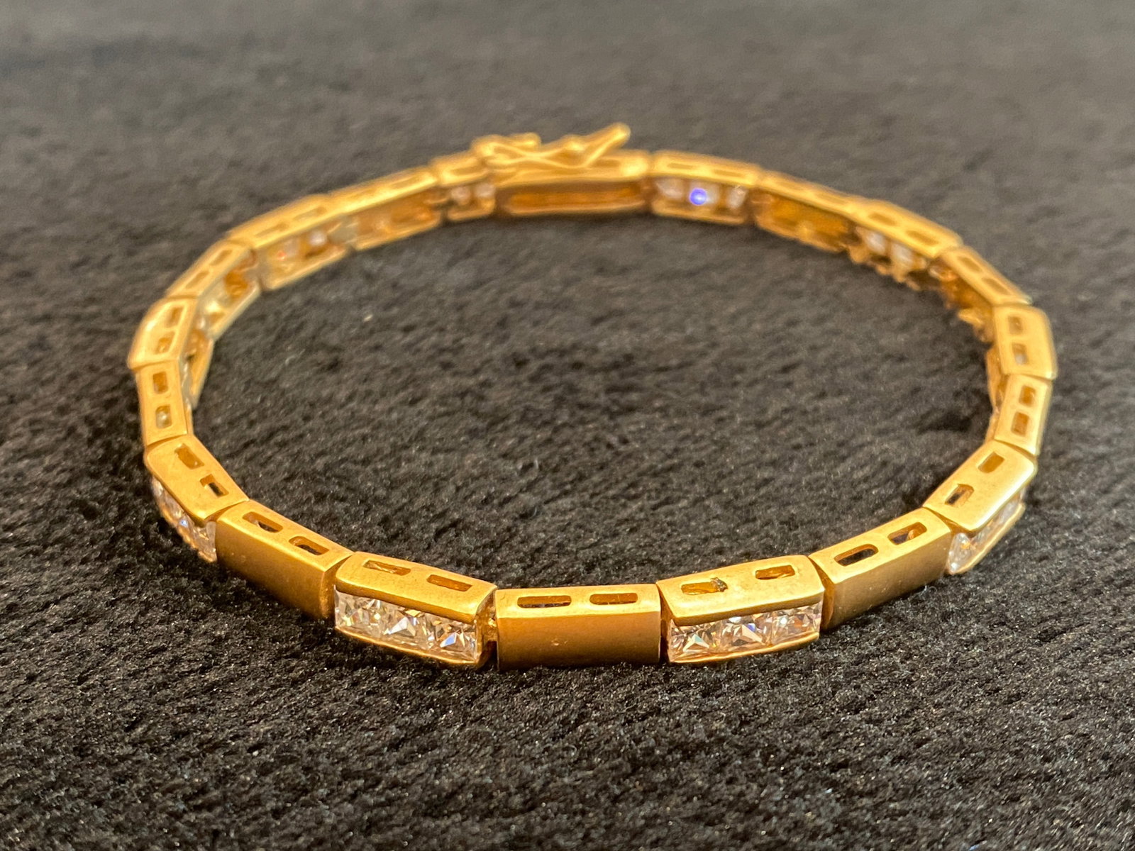 Yellow Gold Tone CZ Box Shape Tennis Bracelet: Gold Diamonds Box Shape Tennis Bracelet. Size 7.5in long. Ships from Austin, TX.