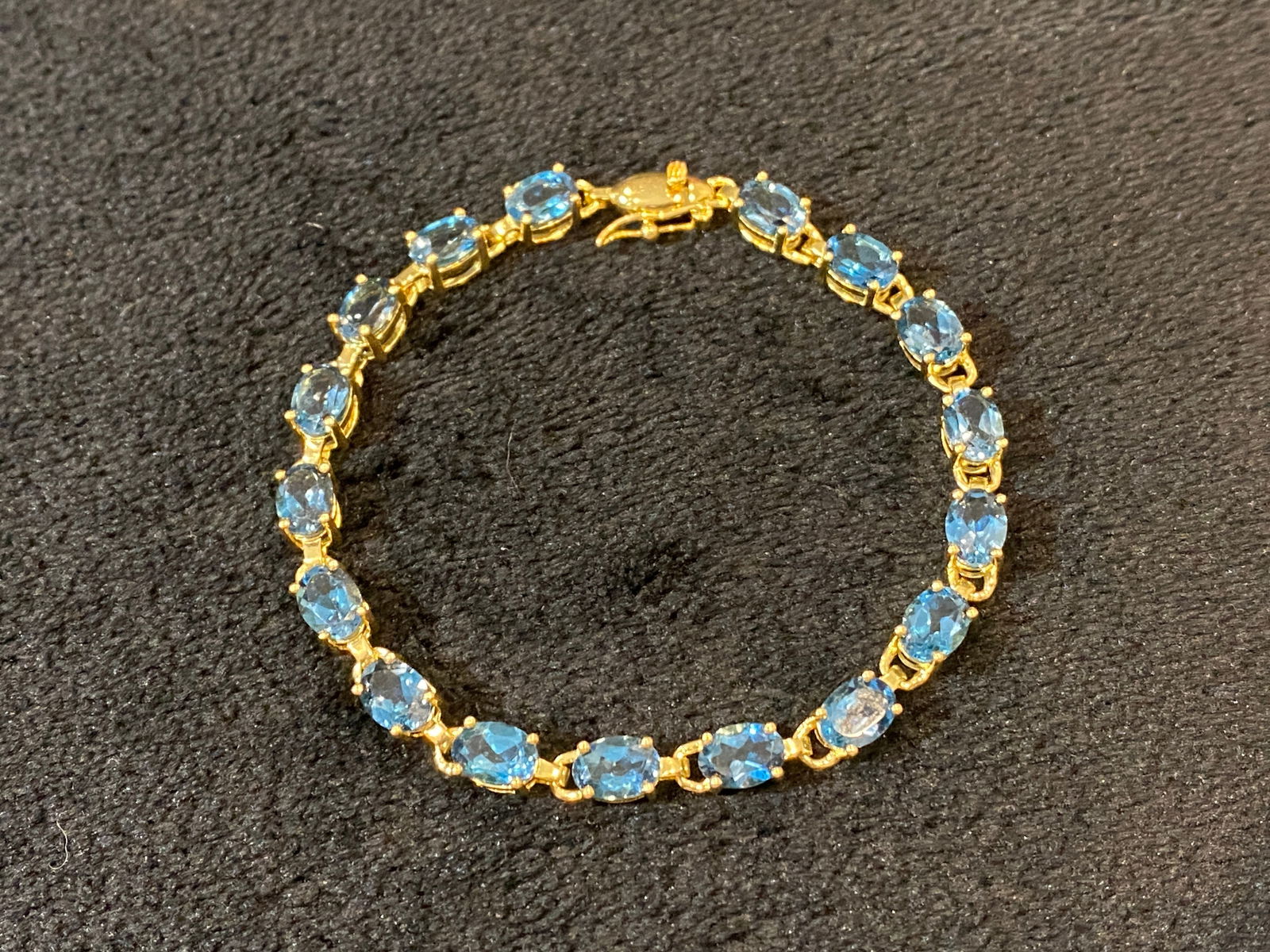 LONDON BLUE TOPAZ 17.00 CTW OVAL 18K YELLOW GOLD OVER STERLING SILVER BRACELET - Size 7.5 (1 of 3)