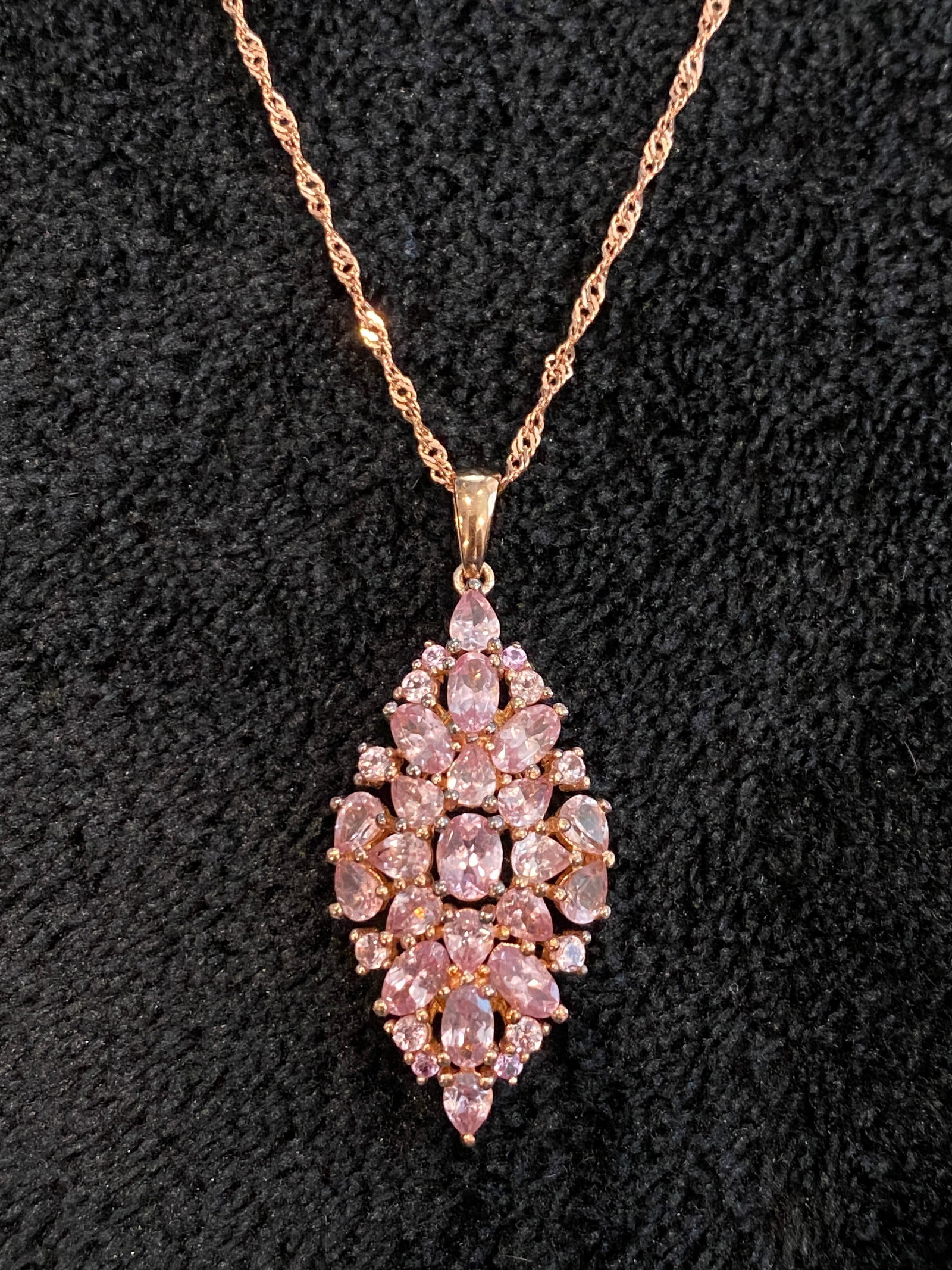 Pink color shift garnet rose gold tone over silver pendant with chain 5.05ctw: Pink color shift garnet rose gold tone over silver pendant with chain 5.05ctw. 2.50ctw pear shape, 2.11ctw oval, .34ctw round color shift garnet and .10ctw round pink sapphire rose gold tone over ster