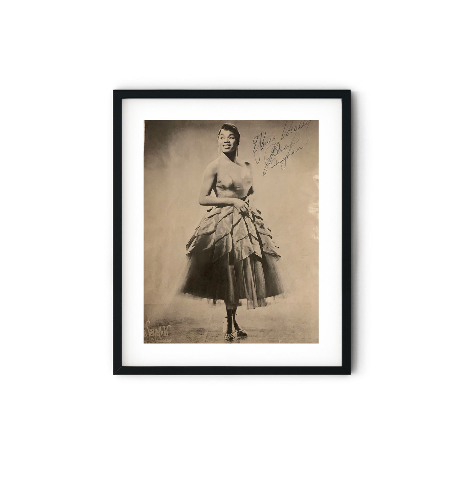 Sarah Vaughan signed Photo: Sarah Vaughan signed Photo. 9x12 inches. Sarah Lois Vaughan was an American jazz singer. Aka, Sassy, and, The Divine One, she won four Grammy Awards, including the Lifetime Achievement Award. She was