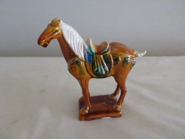 ORIENTAL FURNITURE TANG HORSE STATUE: Tang Dynasty came with the introduction of multicolored, soft glazes for use on ceramics Tang Dynasty ceramic pieces include earthenware objects with tricolor glazes in amber, green and yellow Ensures