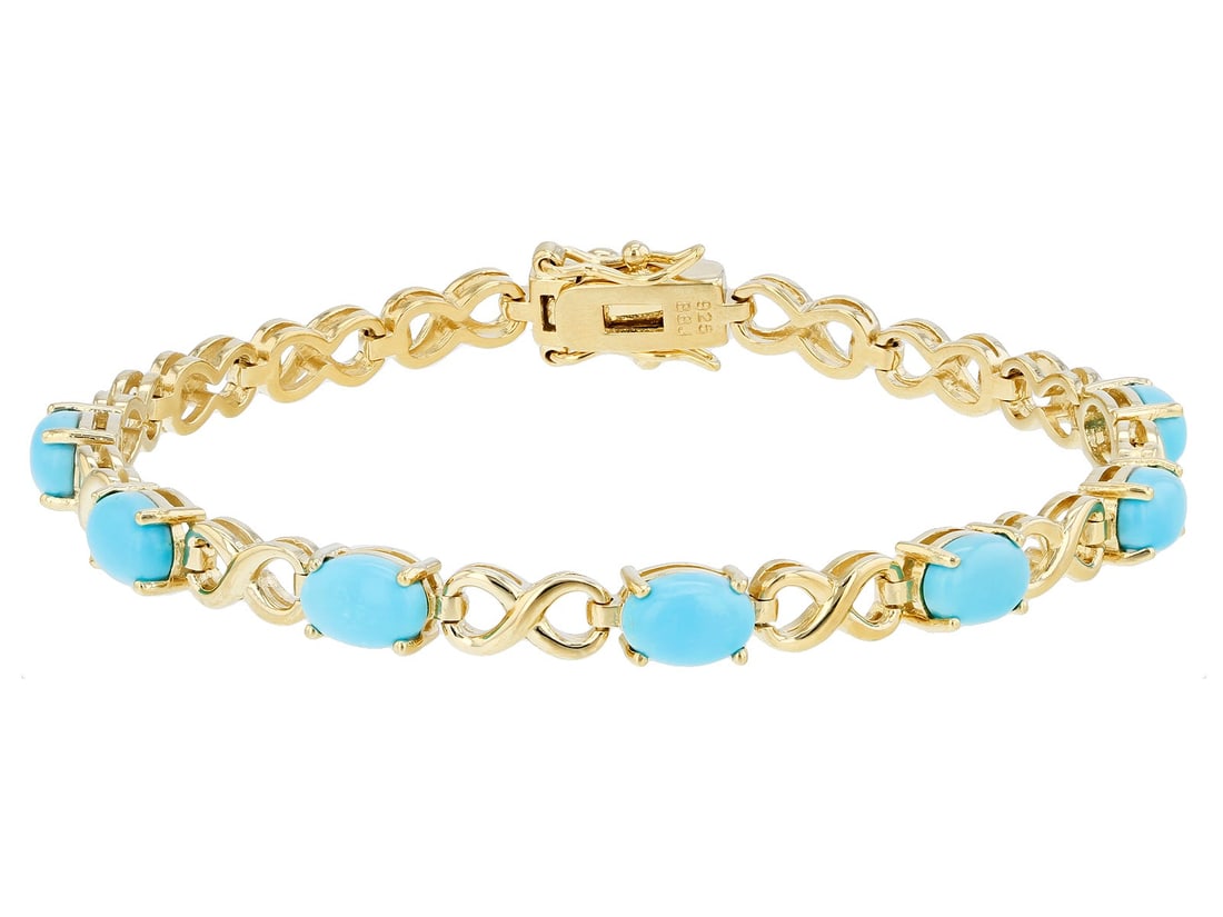 Blue Sleeping Beauty Turquoise 18k Yellow Gold Over Sterling Silver Tennis Bracelet: Blue Sleeping Beauty Turquoise 18k Yellow Gold Over Sterling Silver Tennis Bracelet. 7x5mm Oval Sleeping Beauty Turquoise 18k Yellow Gold Over Sterling Silver Tennis Bracelet. Measures Approximately 0