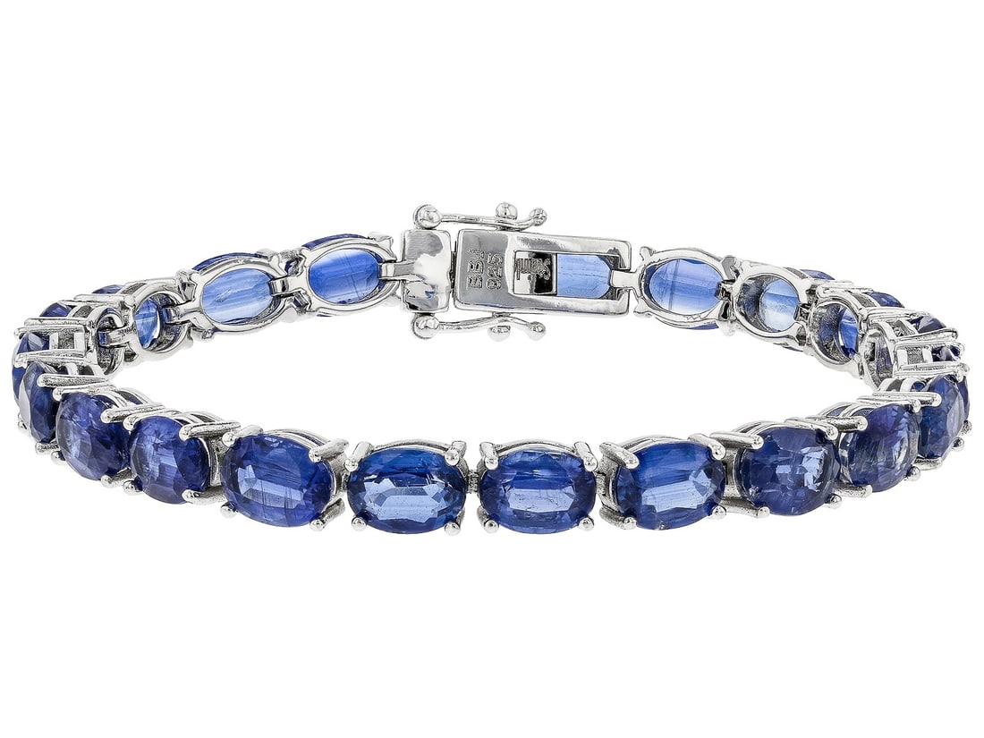 Blue Kyanite Rhodium Over Sterling Silver Tennis Bracelet 28.56ctw.: Blue Kyanite Rhodium Over Sterling Silver Tennis Bracelet 28.56ctw. 28.56ctw Oval Kyanite Rhodium Over Sterling Silver Tennis Bracelet. Measures Approximately 0.23"W. Hidden Box Clasp Closure With Dou