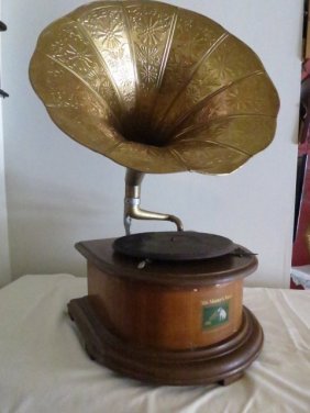 REPRODUCTION PHONOGRAPH RECORD PLAYER: Antique Reproduction Wood Base Gramophone Phonograph Gold Brass Horn This replica Gramophone / Phonograph is a beautiful and accurate reproduction of a vintage antique phonograph. It's handcrafted in