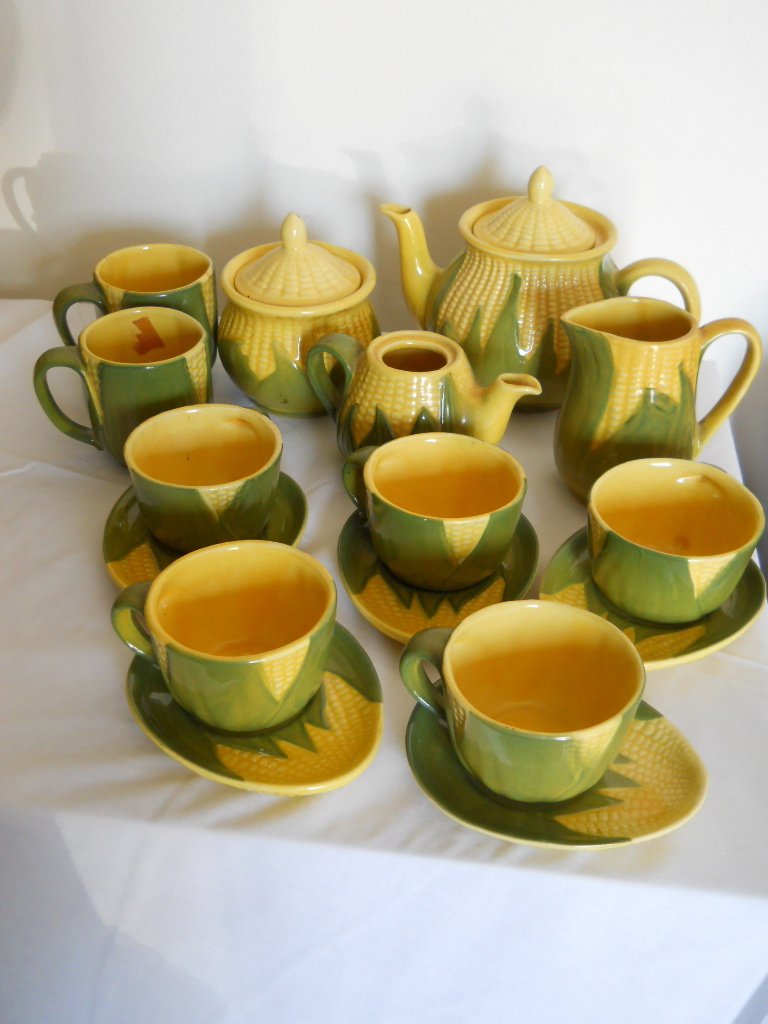 SHAWNEE CORN KING,CERAMIC TEA/COFFEE SET.18PC: CORN KING,SHAWNEE CORN CERAMIC TEAPOT,SUGAR,CREAMER X 2,5 TEACUPS AND SAUCERS,2 COFFEE MUGS