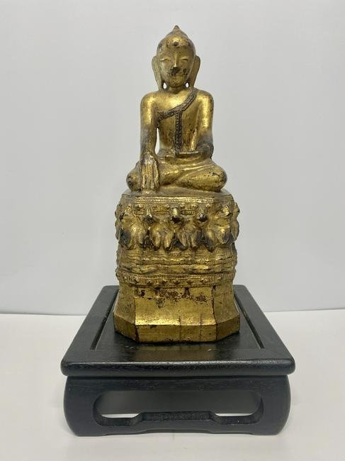 Gilt Wooden Shan Buddah Figure w/ Stand: Gilt Wooden Shan Buddah Figure w/ Stand - This shan buddah is sitting in the "Calling The Earth To Witness" position. Includes legs crossed, the left hand in the lap, and the right hand pointing to th