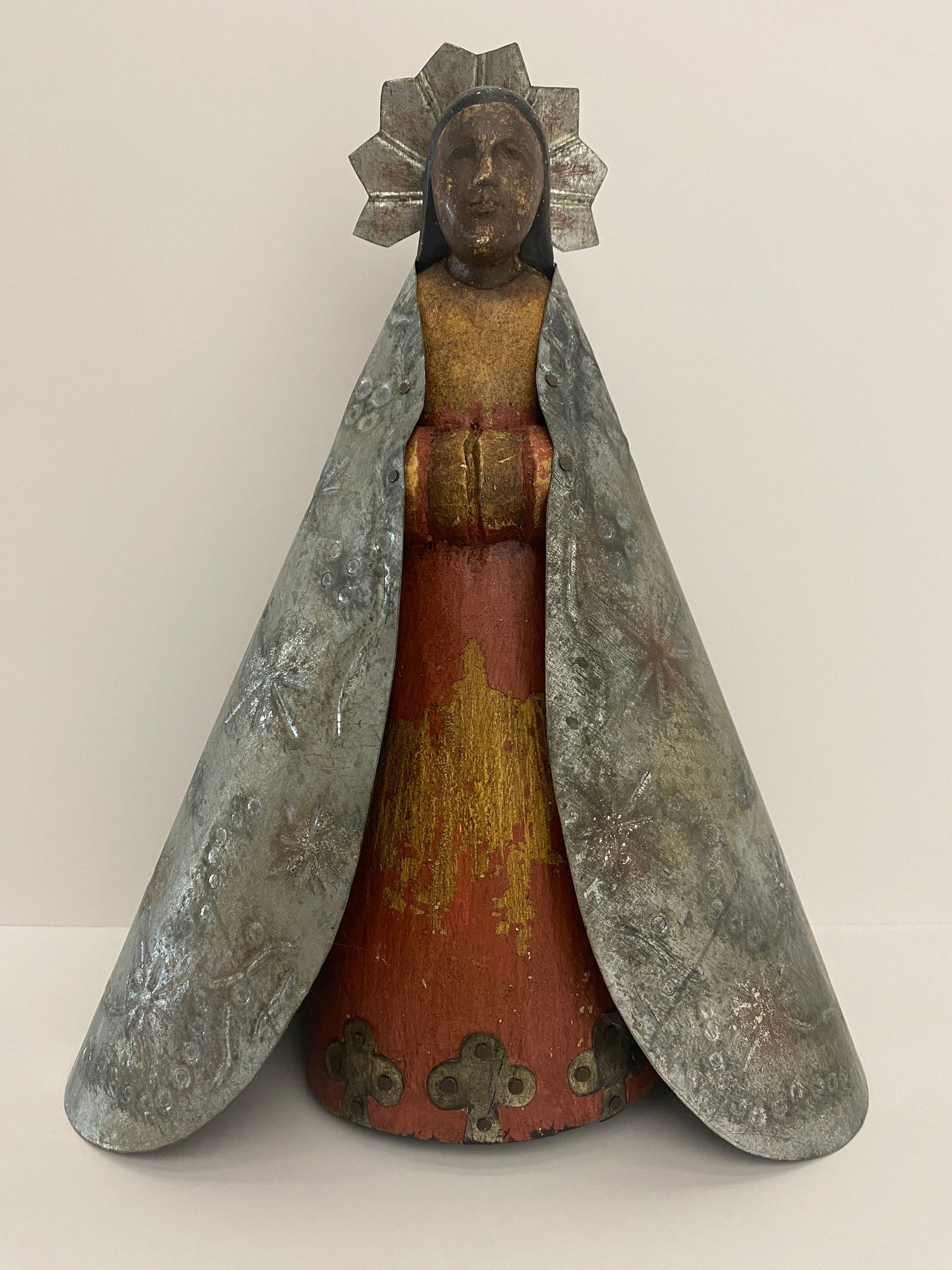 Virgin Mary / Madonna Statue Wood with Metal Cape: Shipping from Austin, TX Dimensions: 11 x 9 in A possible representation of the Virgin Mary, especially with the metallic halo which is a symbol of sanctity in Christian iconography.