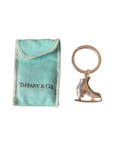 Tiffany & Co. Sterling Silver Ice Skate Keychain: Sterling silver ice skate-shaped keychain from Tiffany & Co., featuring detailed craftsmanship. L: 2 1/2", W: 1", Wt: 1g. Ships from Los Angeles, CA.