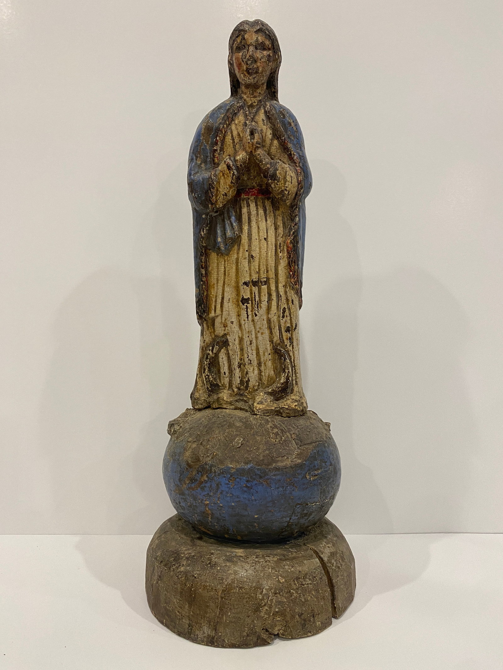 Painted Saint / Santos / Madonna Sculpture w/ Hands Clasped - Blue & White: Shipping from Austin, TX. Dimensions: 14.5 x 5.5 in Presenting a serene depiction of piety, this saint statue (possibly the Madonna of the Immaculate Conception), with hands devoutly clasped, is a spi