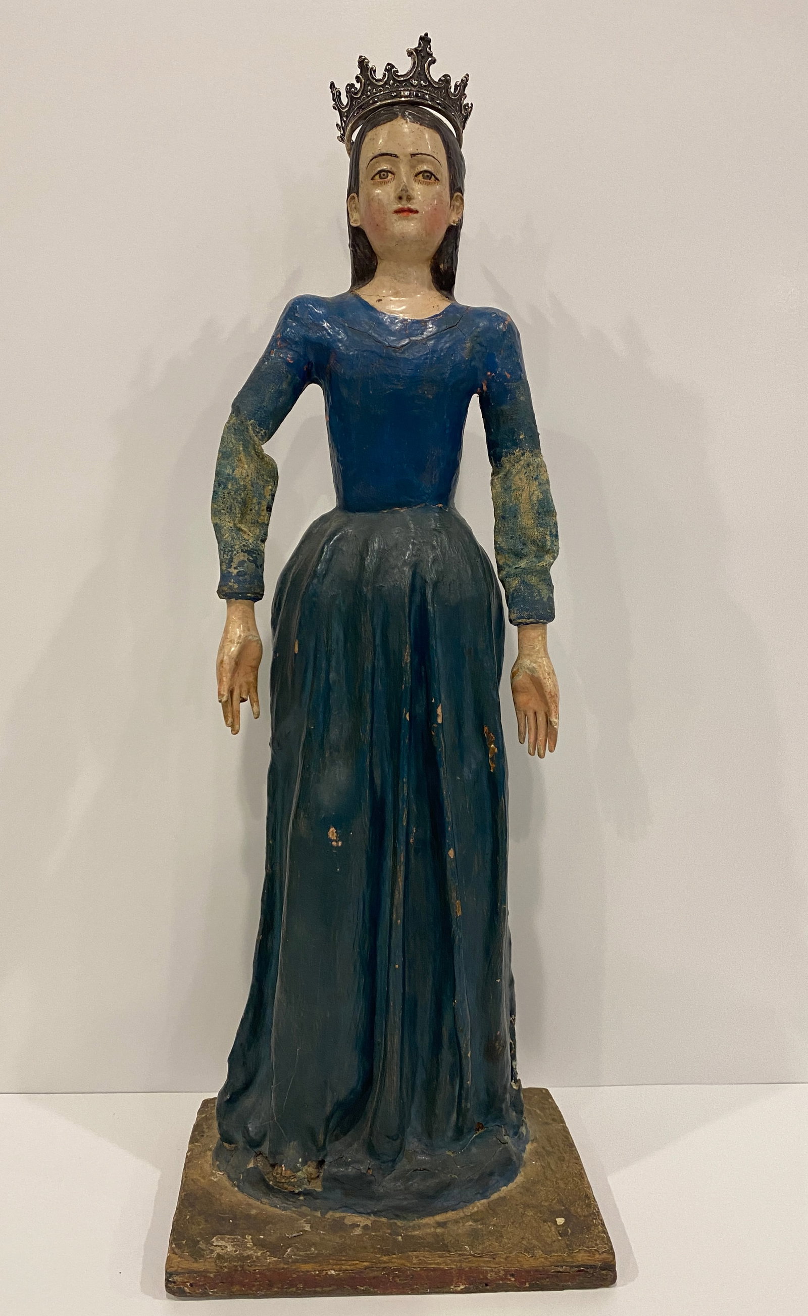Crowned Madonna / Saint Sculpture w/ Blue Dress: Shipping from Austin, TX. Dimensions: 21 x 8 in A hand-painted representation of a crowned female figure. This sculpture of a queen or saintess, with traces of its original paint still visible, offers