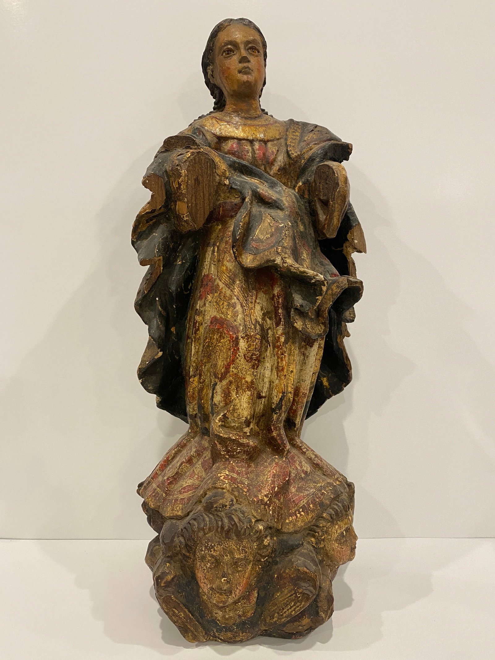 "Assumption of Mary" Standing on Angels Statue: Shipping from Austin, TX. Dimensions: 19 x 8 in Beautifully carved statue with vibrant coloring featuring the madonna. Religious art often depicts her with with angels, but this piece likely represent