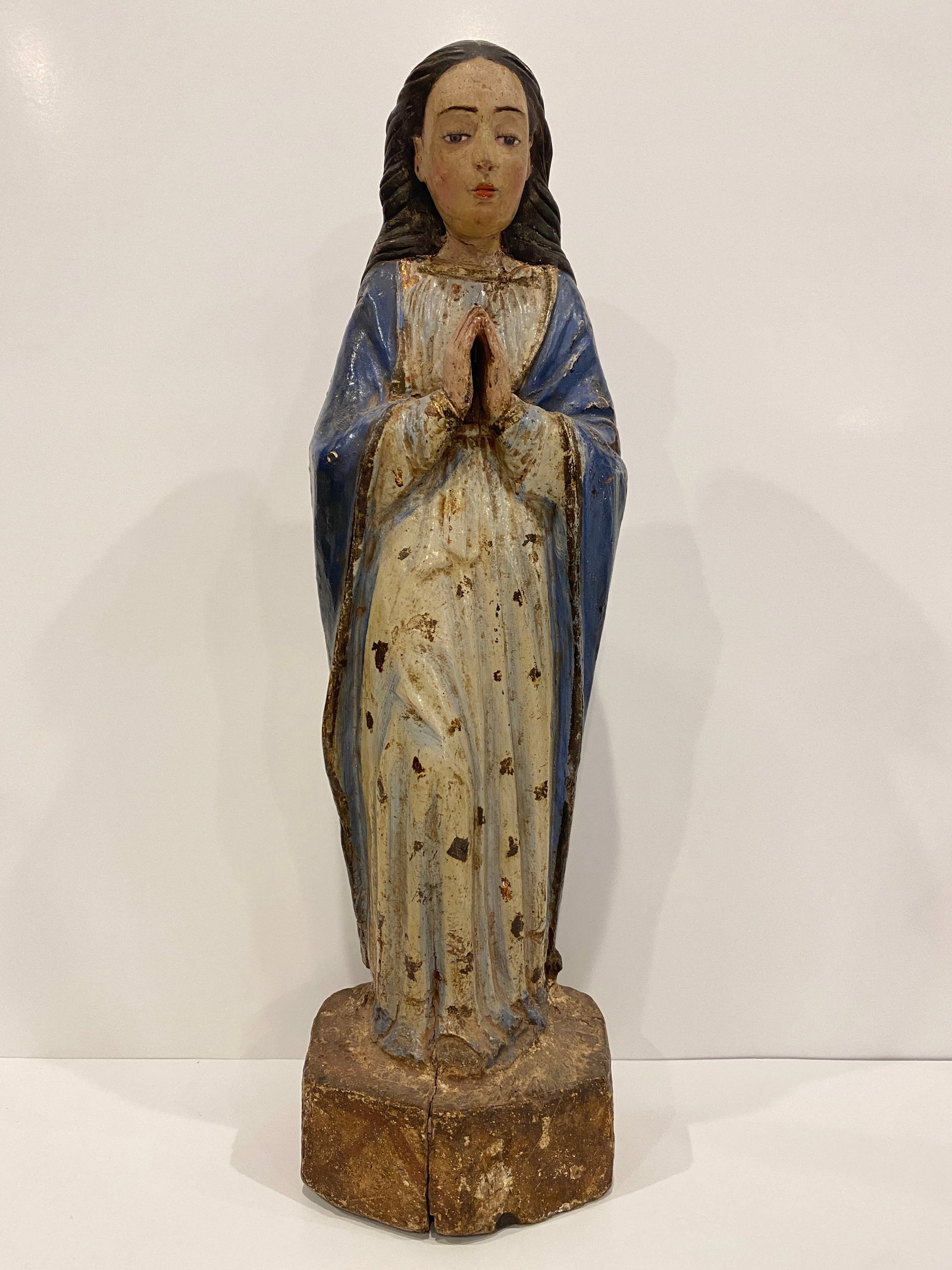 Madonna / Saintess Praying Statue: Shipping from Austin, TX. Dimensions: 18.5 x 5.5 in Crafted from wood, this figure carries the weight of history in its weathered blue robe and prayerful demeanor. Ideal for collectors of Christian ar
