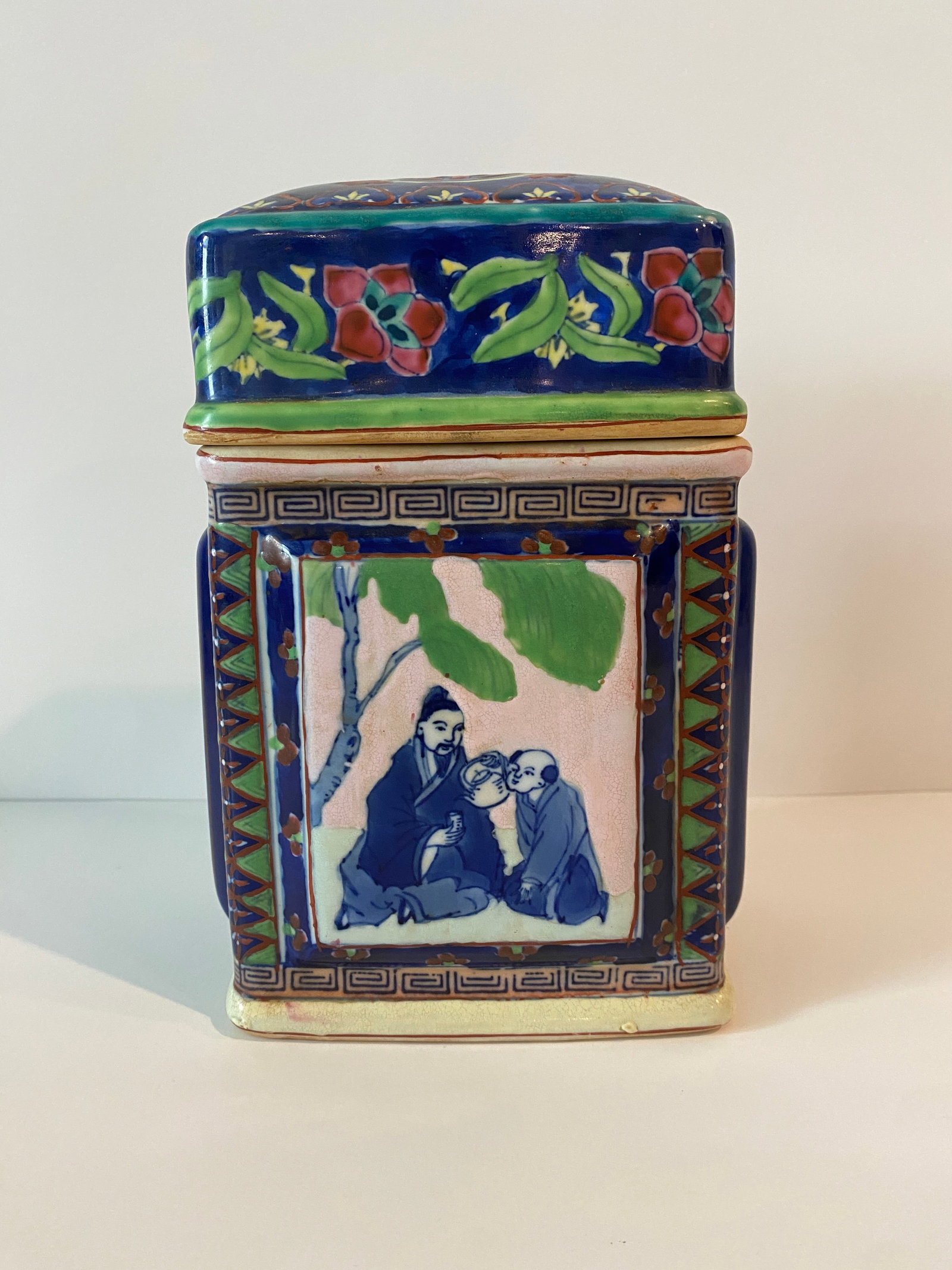 Chinese Porcelain Rectangular Lidded Jar Featuring Handpainted Scenes: Shipping from Austin, TX. Dimensions: 7.5 x 5 in Beautifully painted Chinese rectangular jar with lid, each side depicts a different scene, colors are primarily blue, green and white with touches of r
