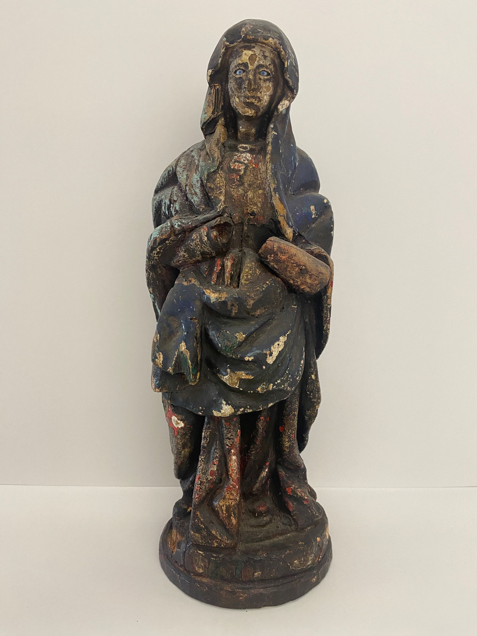 Virgin Mary / Madonna Statue: A religious sculpture of the Virgin Mary, such religious figures are often valued for their historical and artistic qualities. Wooden sculptures like this one can be traced back to various periods and