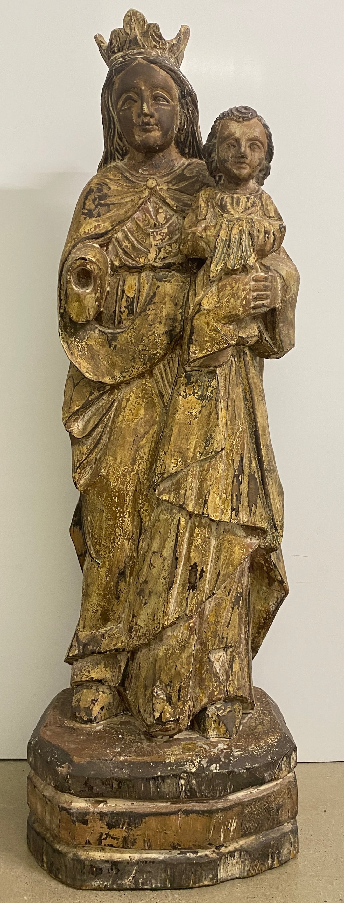 Crowned Madonna and Child - Wood Sculpture: Impressive crowned Madonna and Child wooden statue is a stunning piece of religious art. Hand-carved with meticulous detail, this vintage Madonna and Child sculpture features a crowned Madonna, symbol