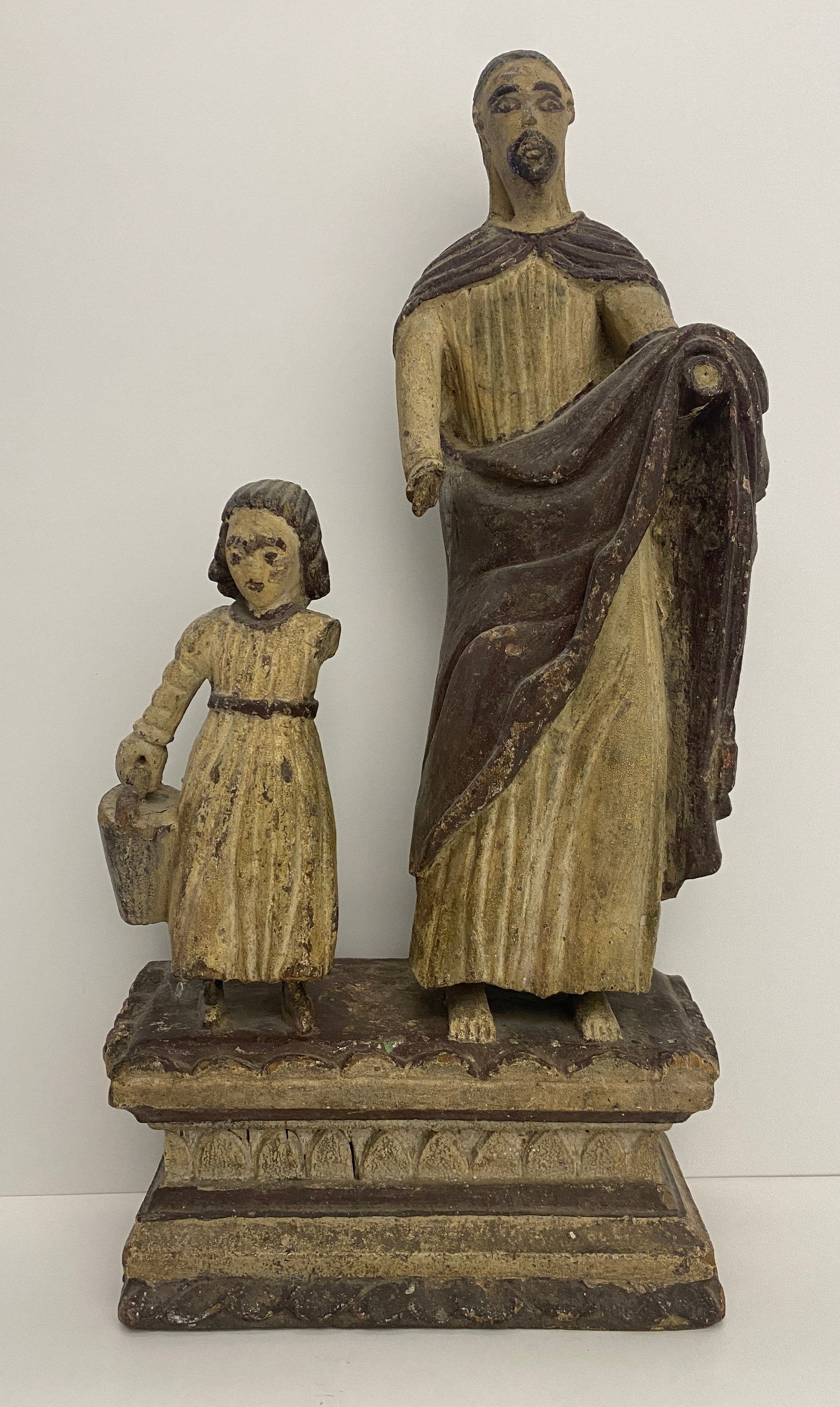 Saint and Child Figurine - Spanish Colonial: This exquisite Spanish Colonial wooden saint and child sculpture is a stunning example of religious artistry from the colonial era. Measuring 20 inches by 10 inches, this antique saint and child statu